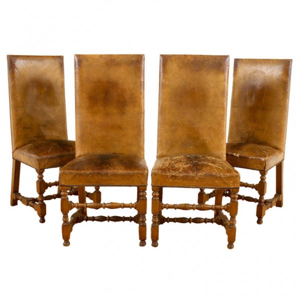 Four Walnut and Leather Upholstered Dining Chairs
