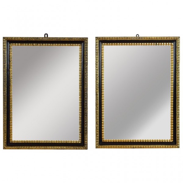 Pair of Ebonized and Giltwood Mirrors