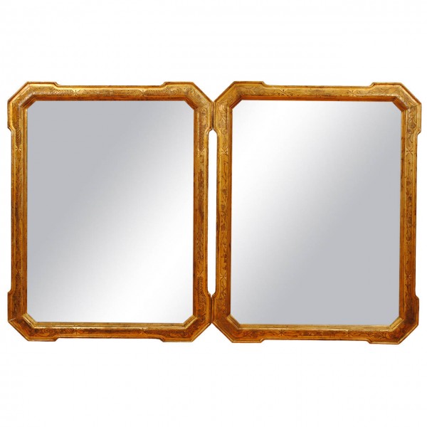 Pair of Ferrara Incised Giltwood Mirrors
