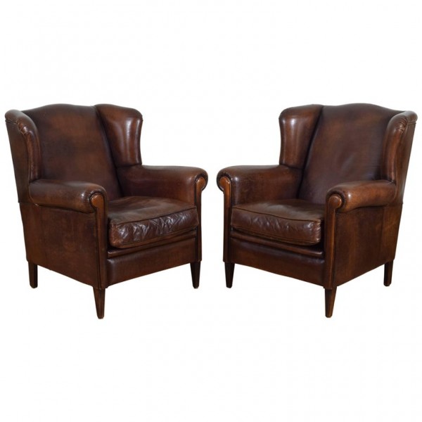 Pair of Leather Upholstered Wingchairs with Piping