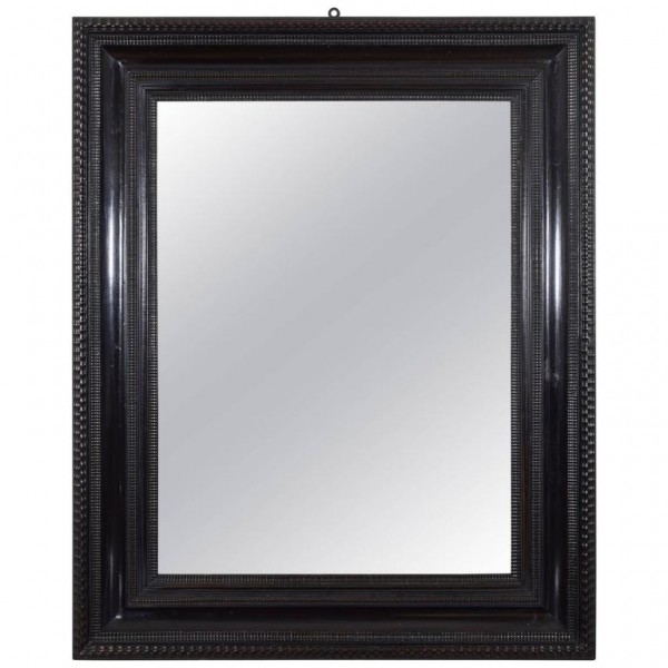 Carved and Ebonized Walnut Mirror