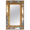 Carved Giltwood and Embossed Gilt-Gesso Mirror