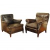 Two Leather Upholstered Club Chairs