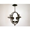 Wrought Iron Oval Lantern with Elaborately Wrought Flowers at the Interior Base