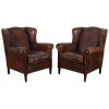 Pair of Leather Upholstered Wingchairs with Piping